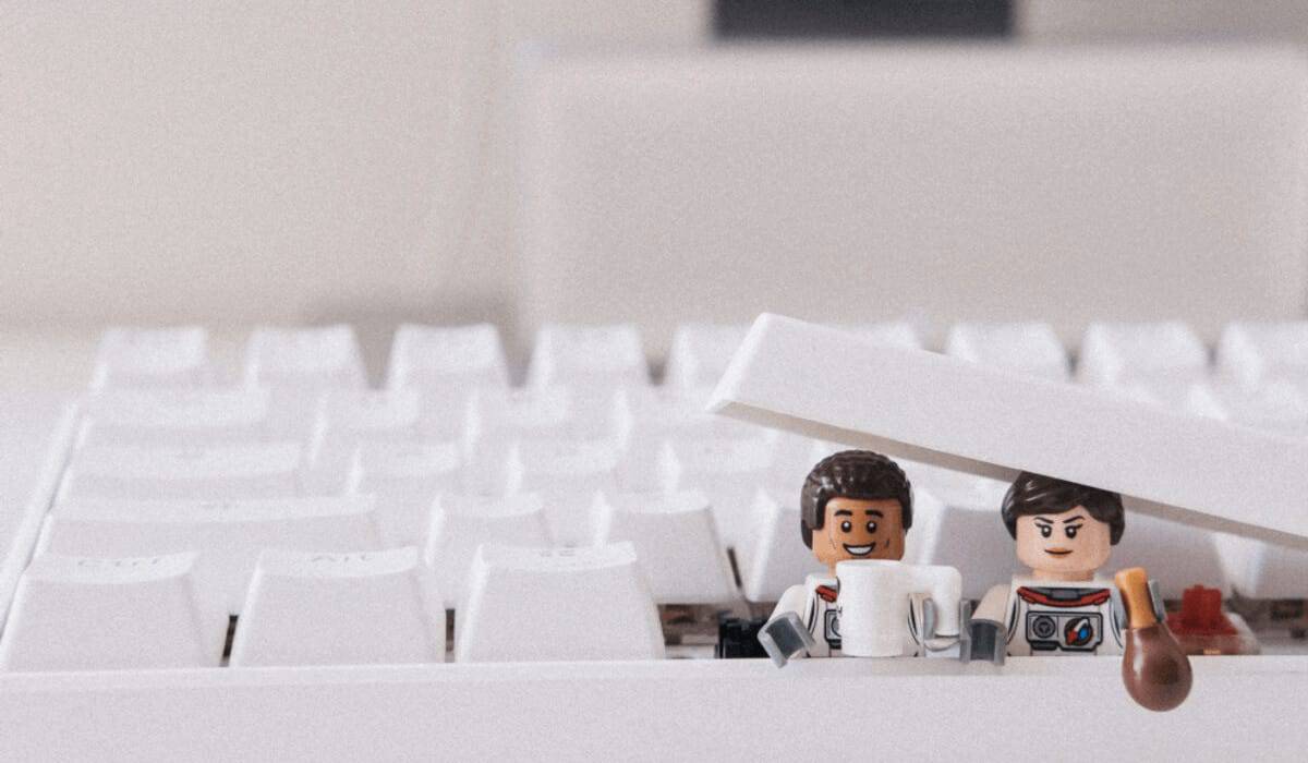 lego people sticking out of a keyboard