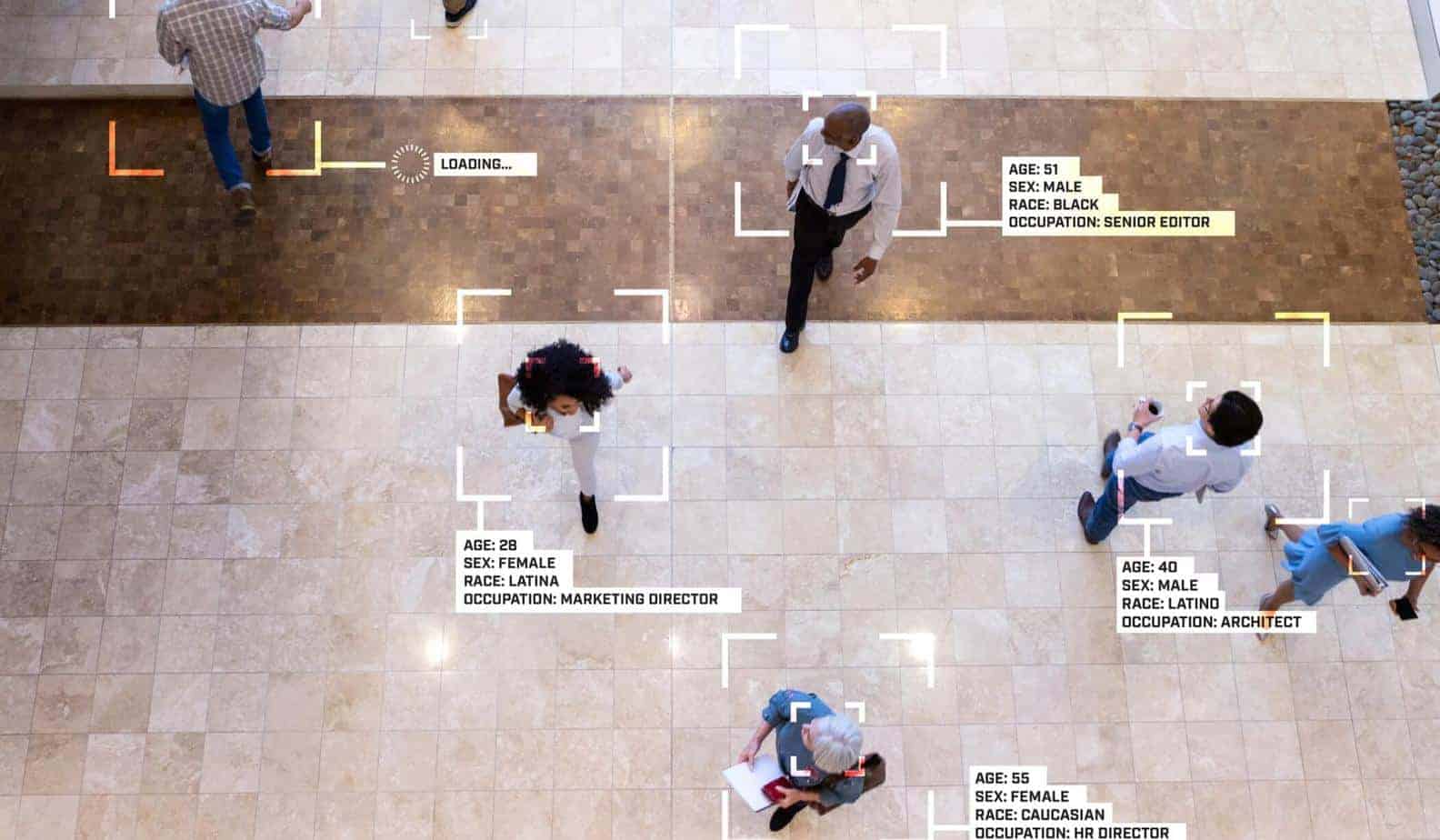 Camera view of face recognition on people walking in lobby