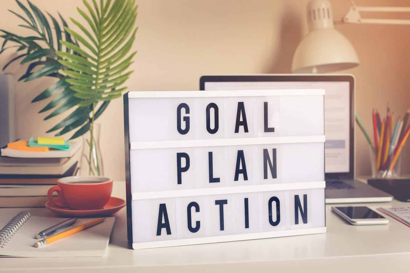 board with "goal plan action" on it