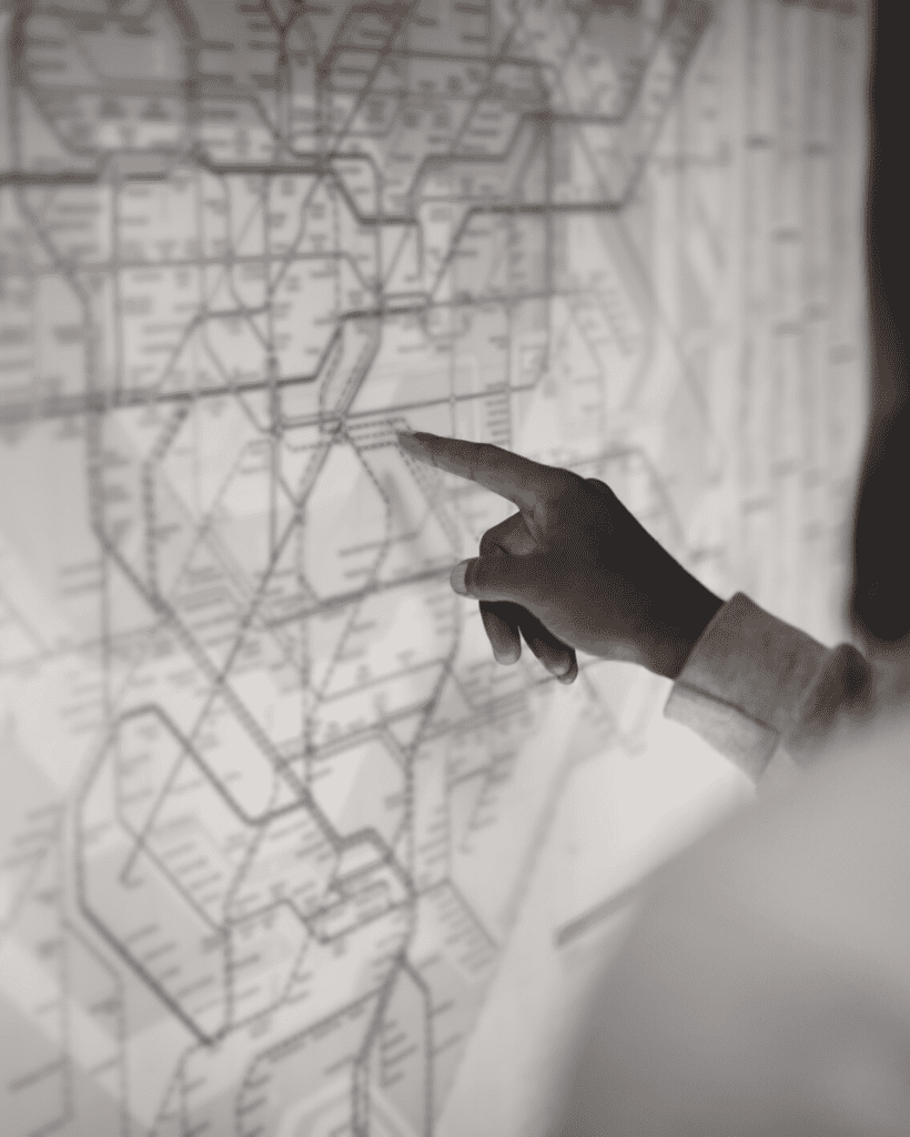 Man pointing at a subway map