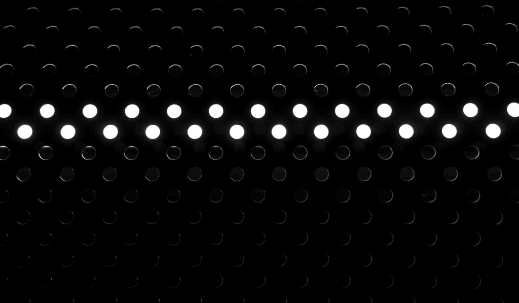 two lines of white dots in a lot of black space