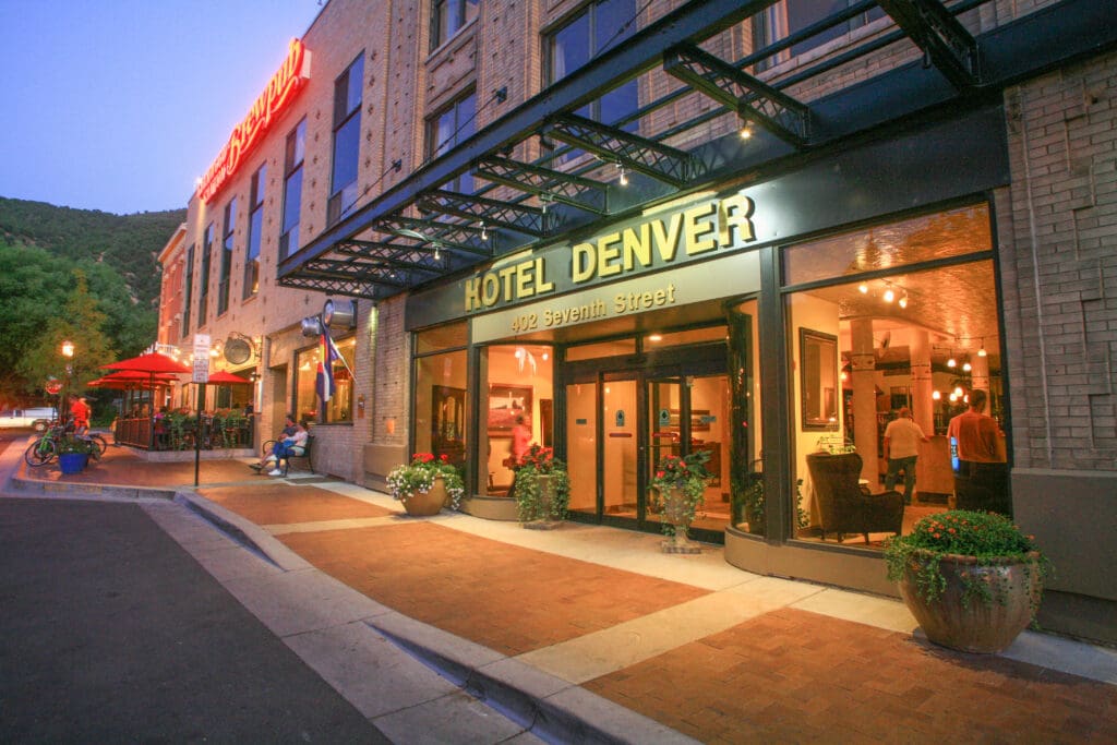 Exterior photo of the Hotel Denver at dusk