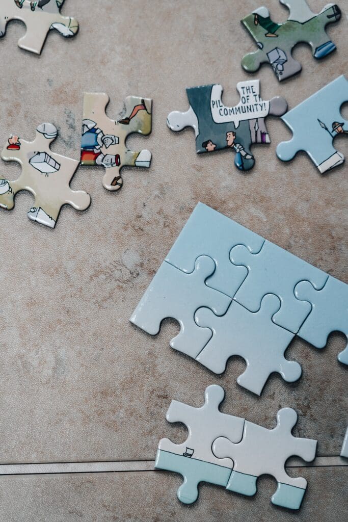 Puzzle pieces on a tile surface representing the social media algorithms "puzzle."