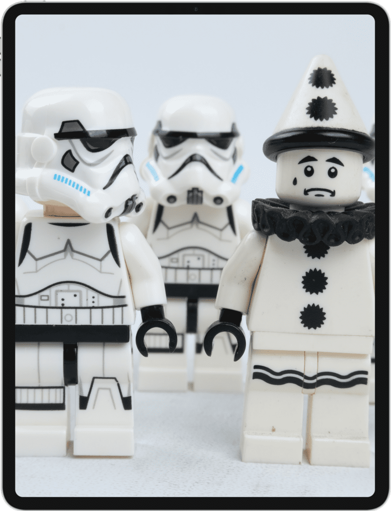 iPad featuring Lego stormtroopers looking at an upset Lego mime
