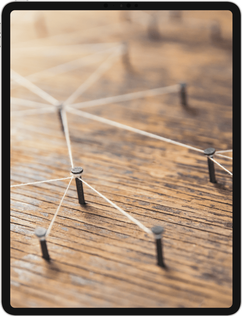 iPad Pro screen featuring strings and nails on a wooden board