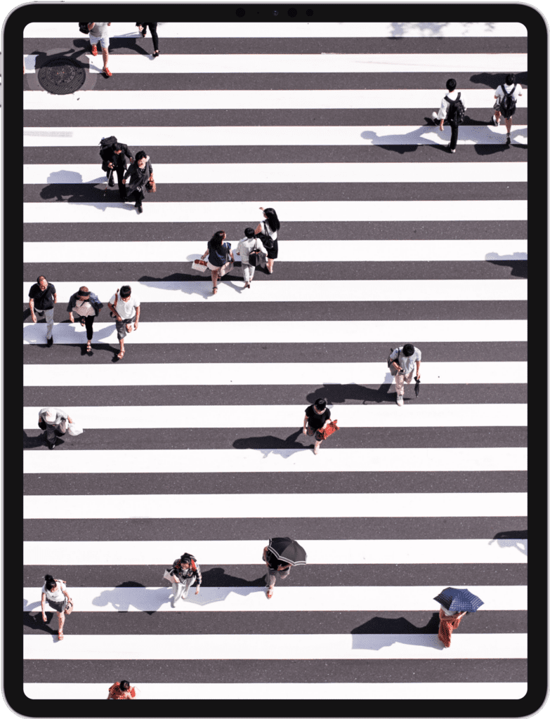 iPad featuring people crossing a very large crosswalk