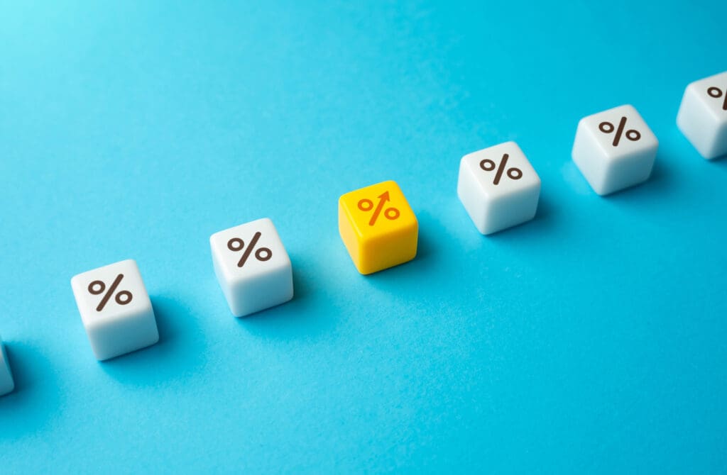 Dice with percent signs, one is yellow and orange with an arrow instead of a line